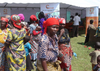 Some of the refugees awaiting counselling at the CARE International tent at the Nyakabande transit centre in Kisoro district.