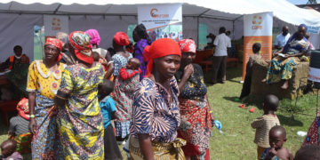 Some of the refugees awaiting counselling at the CARE International tent at the Nyakabande transit centre in Kisoro district.