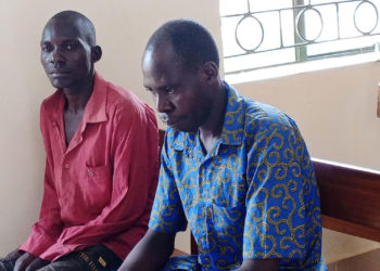 In court, Raymond Esanyu (in a blue kitenge shirt) appeared.